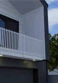 Aluminium balustrade system installed on a staircase, featuring horizontal top and bottom rails with slimline vertical balusters.